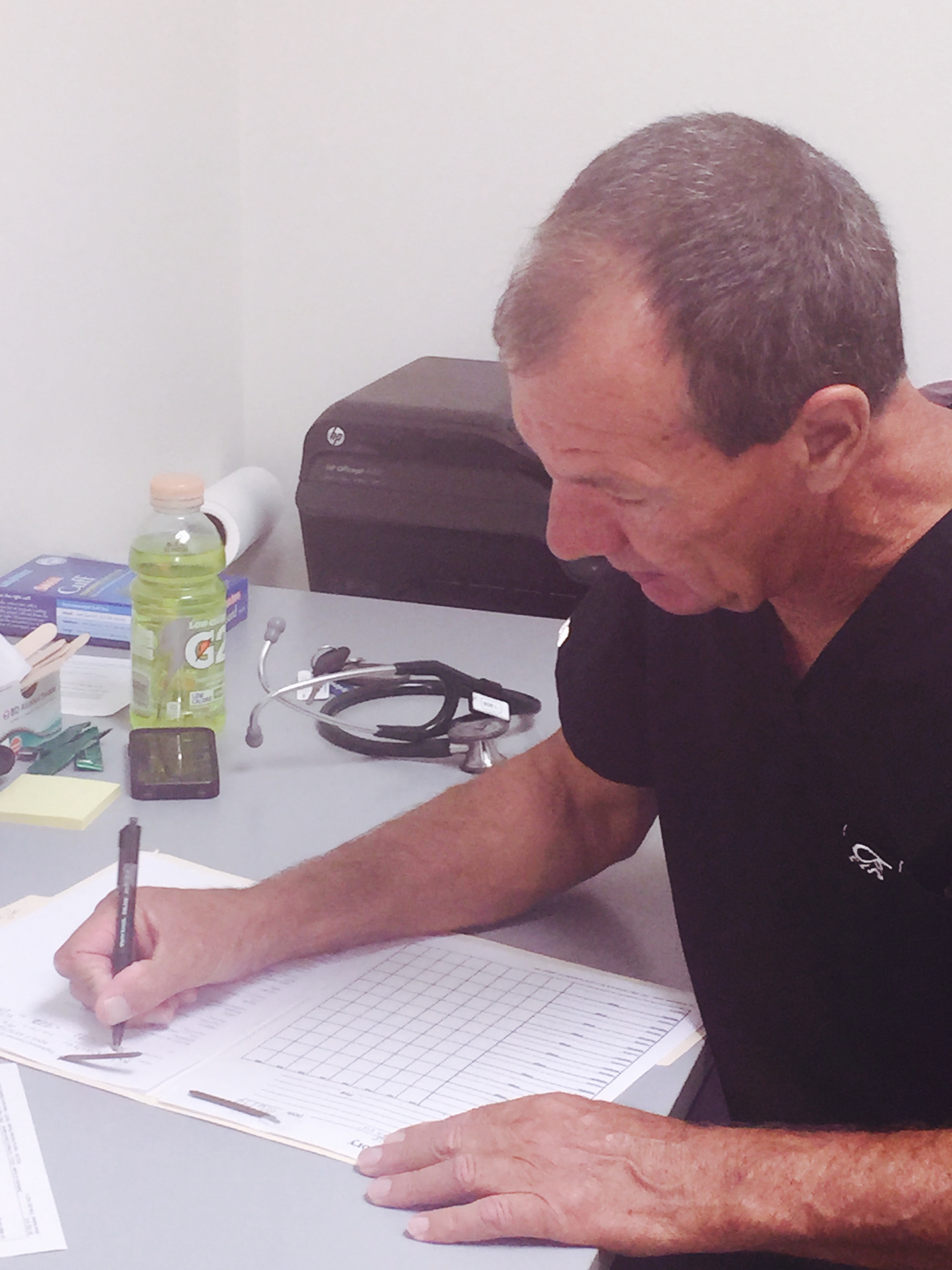 Volunteer Nurse Bob Linehauser intaking a patient