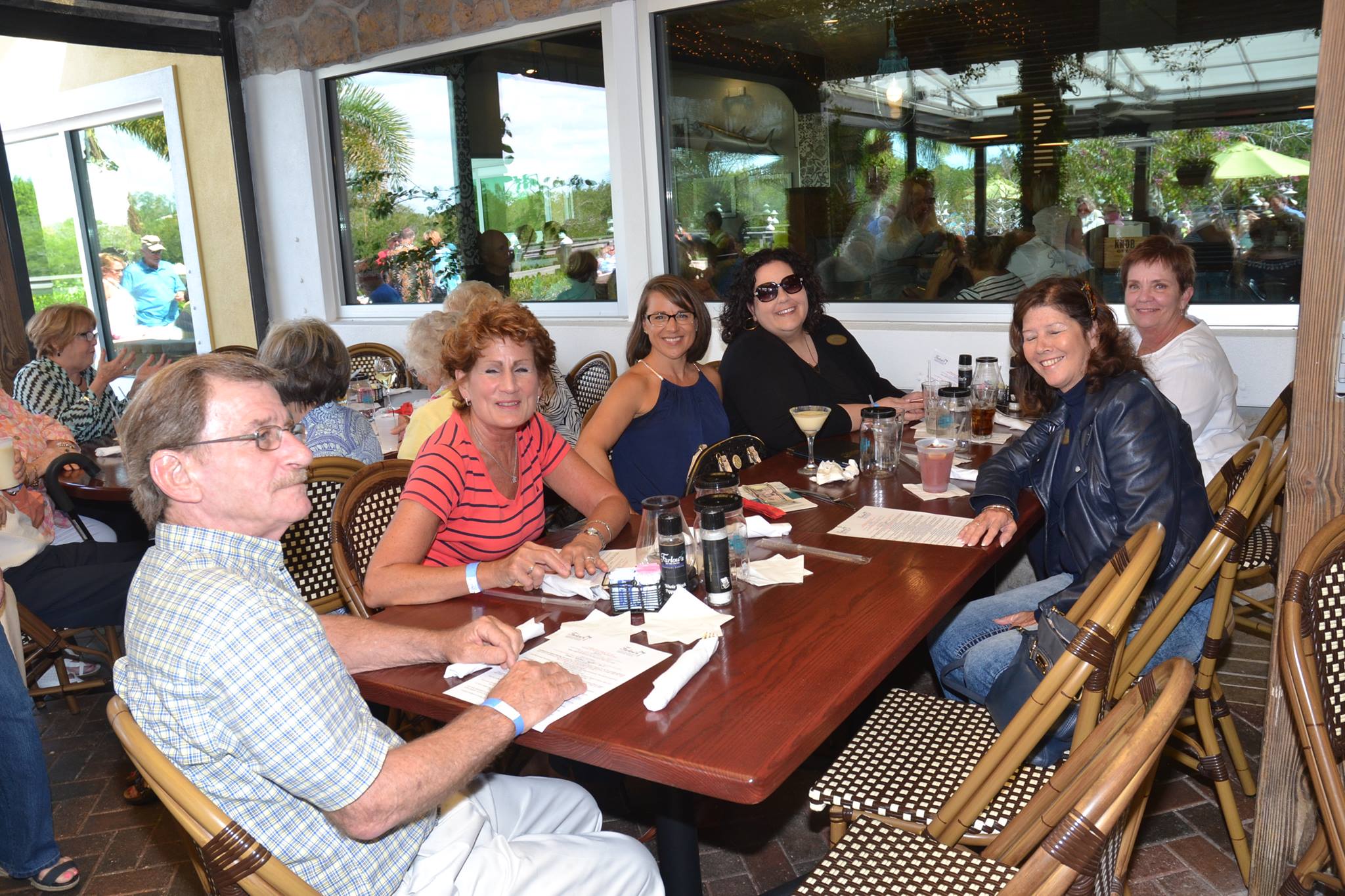 Board members Sue McNamara, Paula Greenland, Liz Rigney, and Joni Hyde enjoy the Farlow's on the Water Fundraiser with their friends and family, February 2016