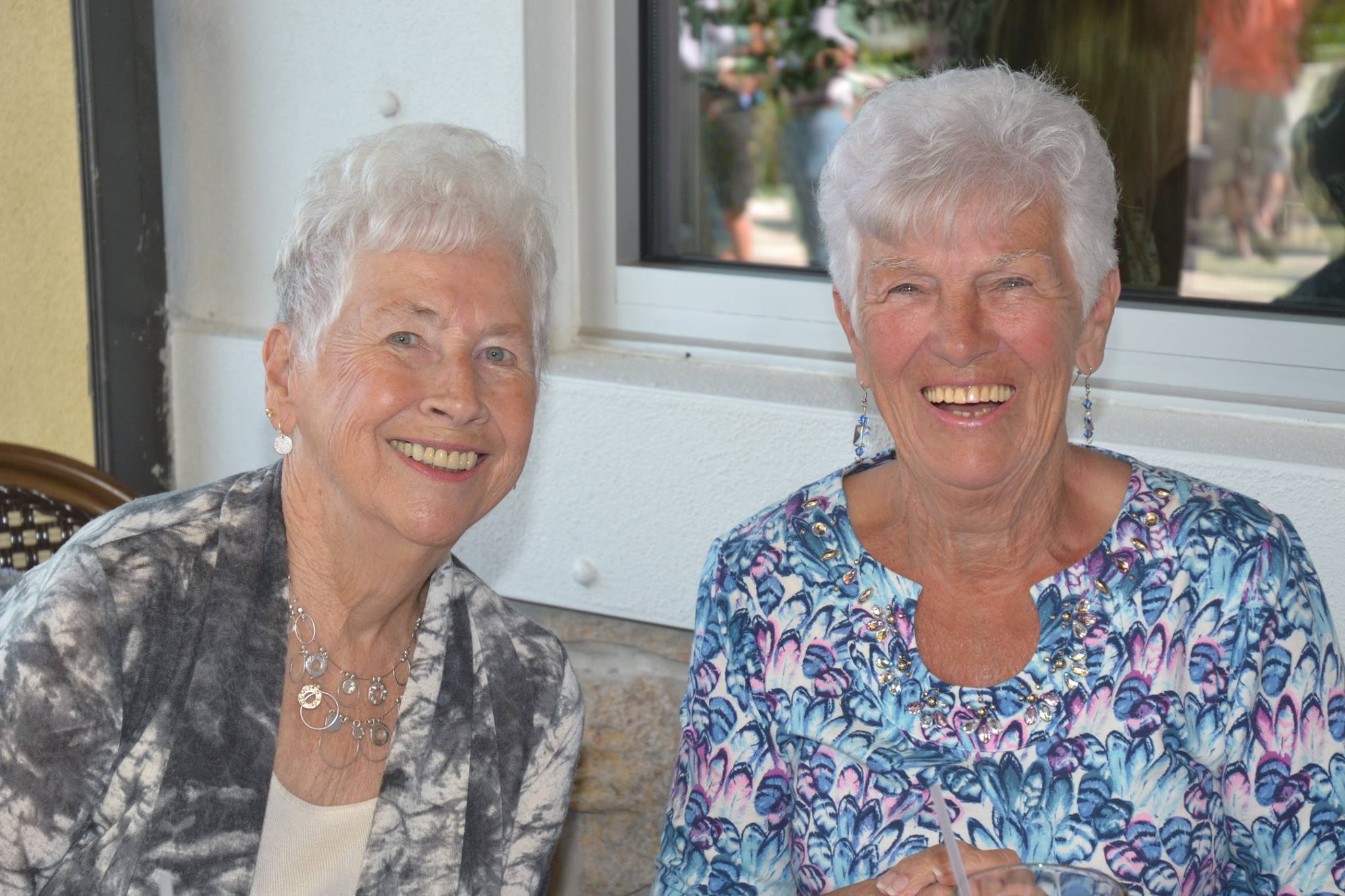 Volunteers Audrey and Millie enjoy drinks and dinner at the Farlow's on the Water fundraiser, February 2016