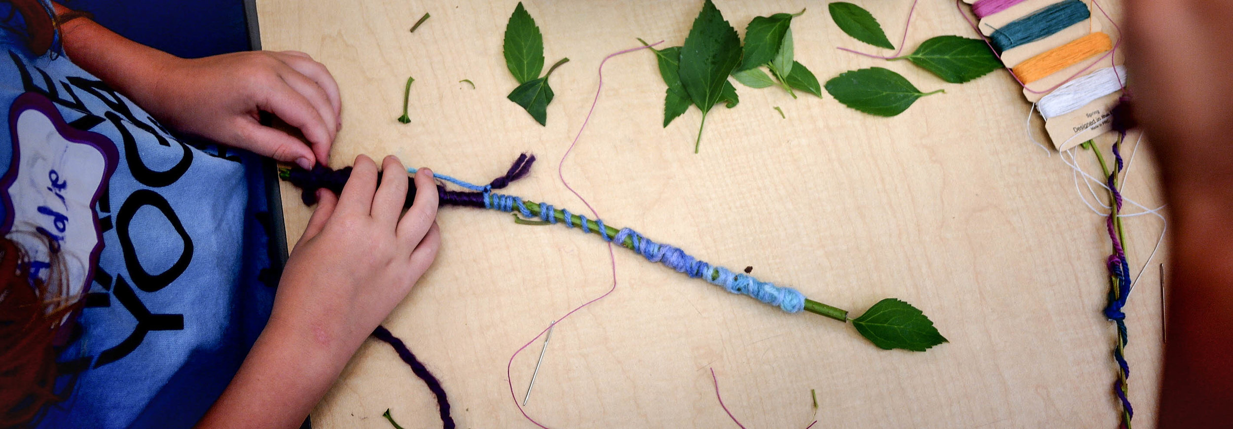 Making magic wands at the Maine Yoga Kids Camp at 2016's Maine Yoga Fest
