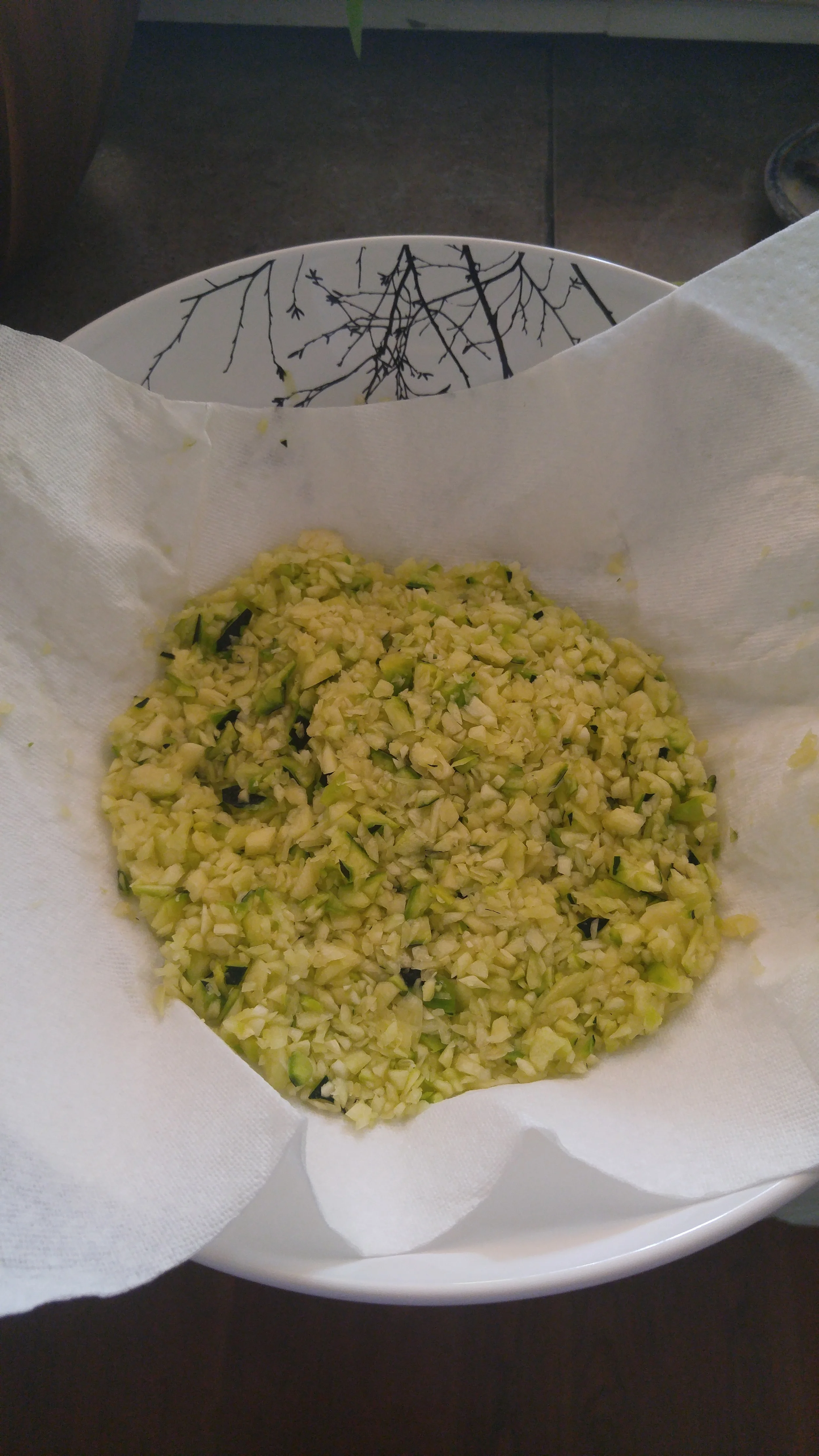 So once your zucchini is grated, squeeze the water out of it.
