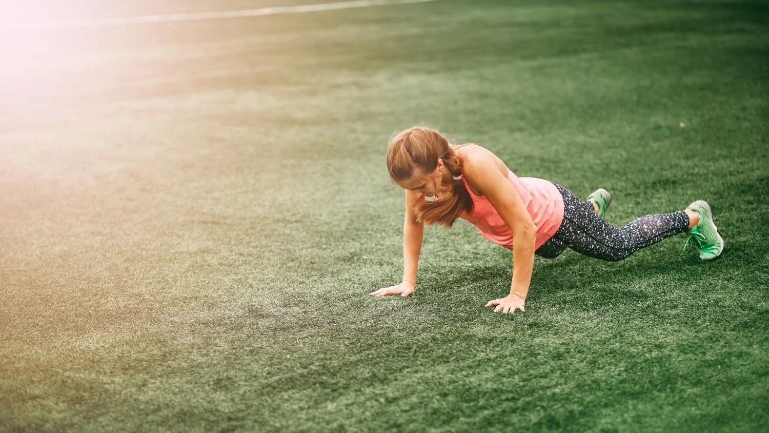 woman performing a burpee