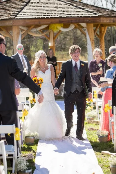 guests-tossing-seed-at-bride-and-groom.jpg