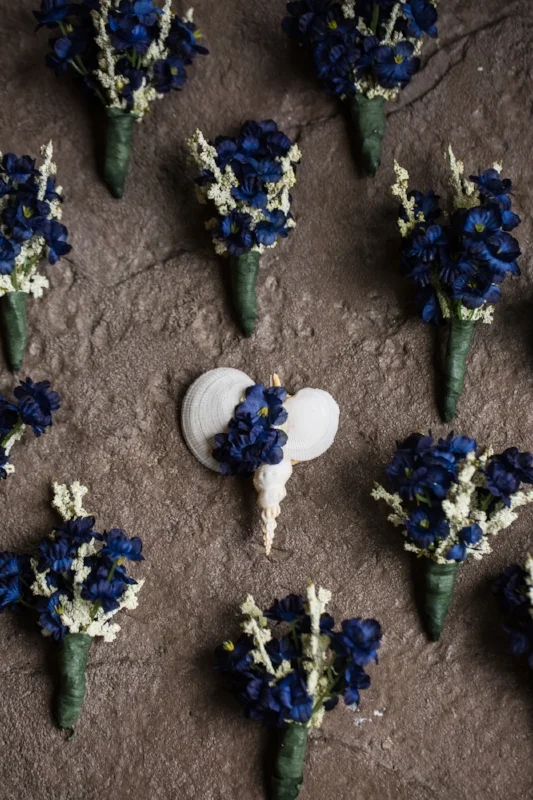 We love these unique boutonnieres. The shells are perfect for a Bahama born groom. 