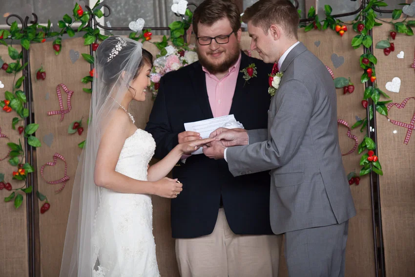 groom-putting-ring-on-brides-finger-nashville-wedding.jpg