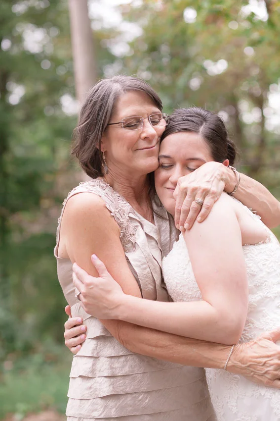mother-hugging-daughter-at-smiley-hollow-wedding.jpg