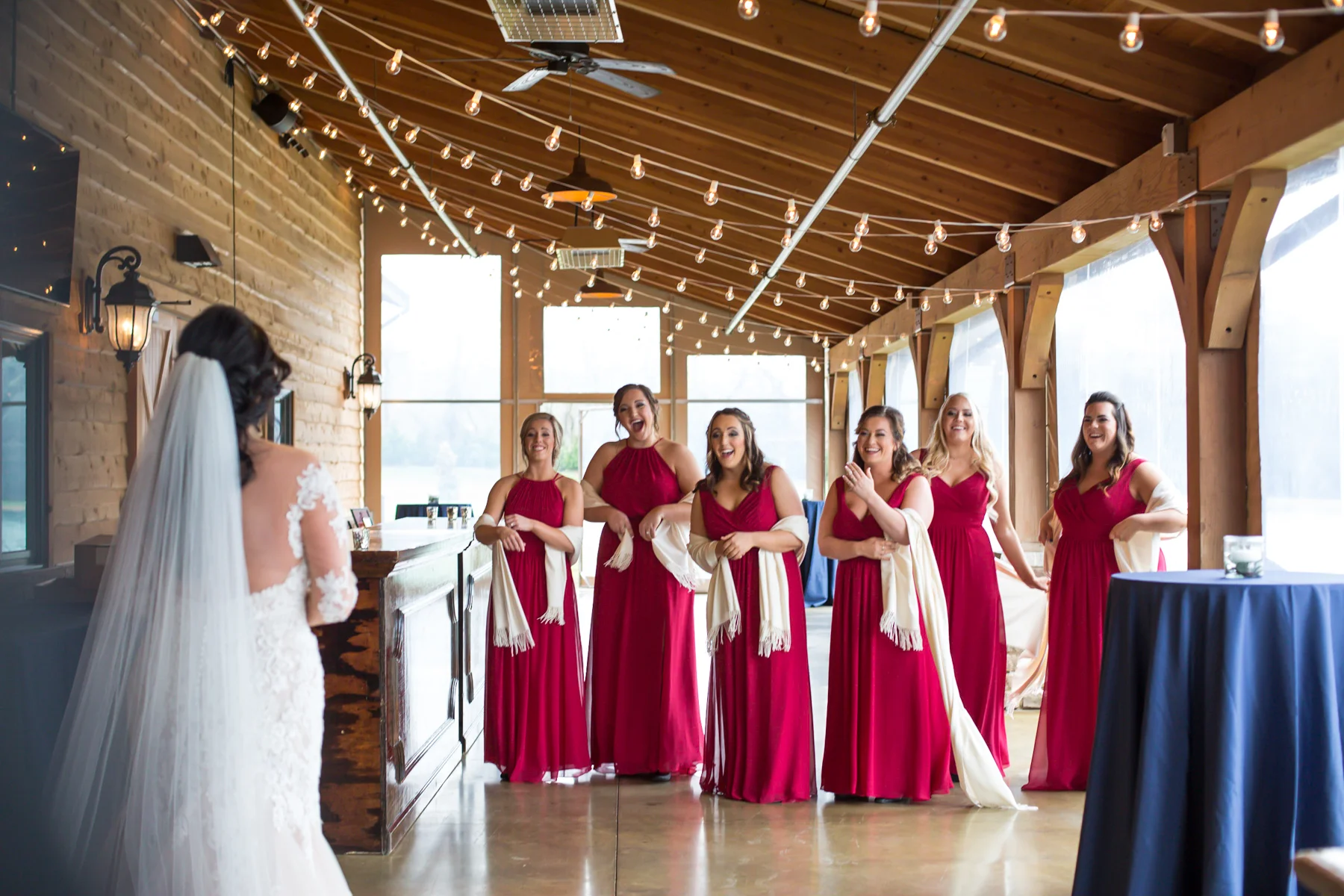 brides-first-look-with-bridesmaids-barn-at-sycamore-farms.jpg