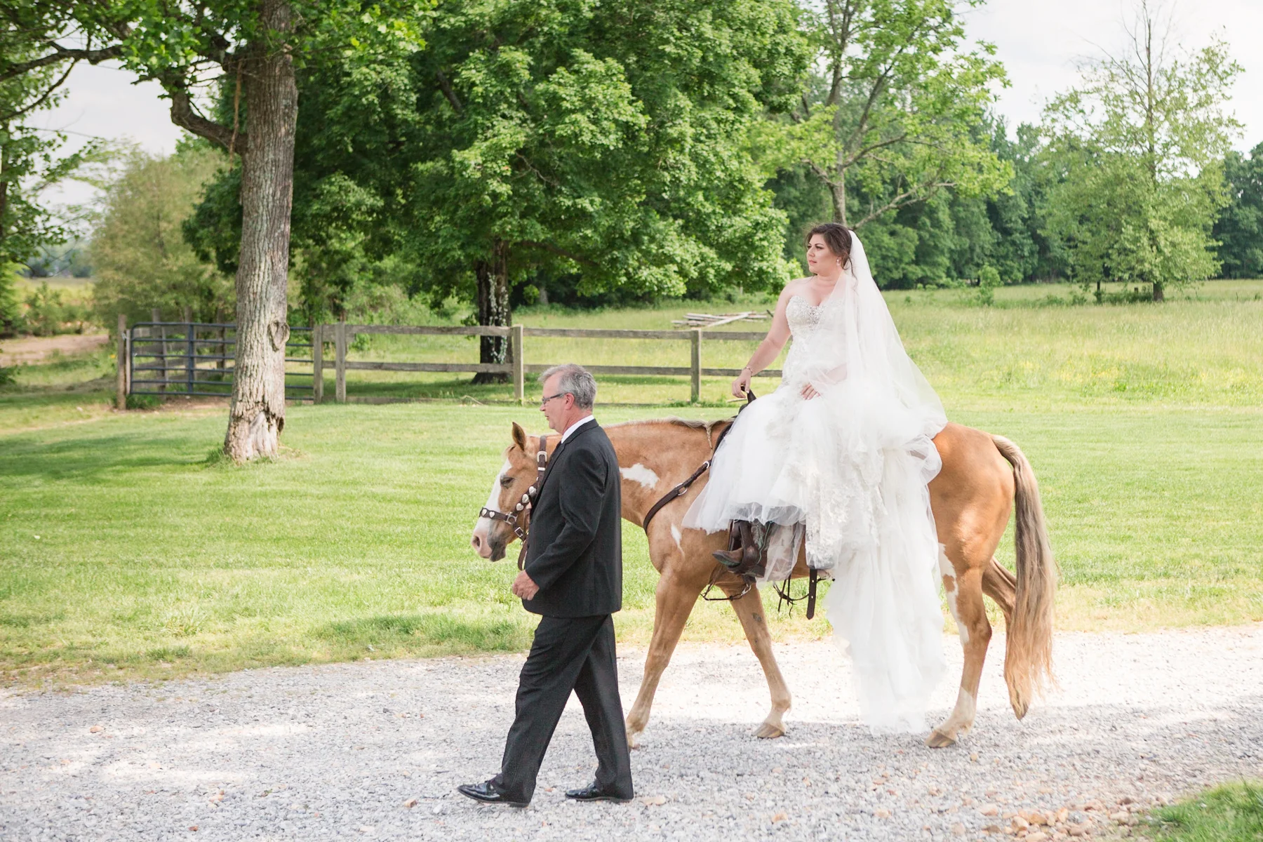 bride-riding-horse-to-alter-cactus-creek-barn.jpg