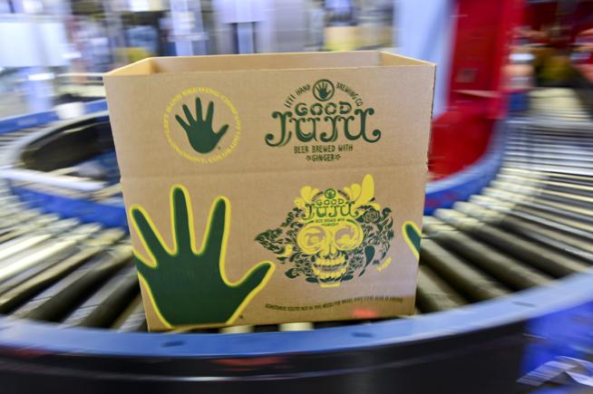 A box on an assembly line at Longmont's Left Hand Brewing. The company announced Wednesday that it would begin offering its craft brews in cans. ( Matthew Jonas / Staff Photographer )