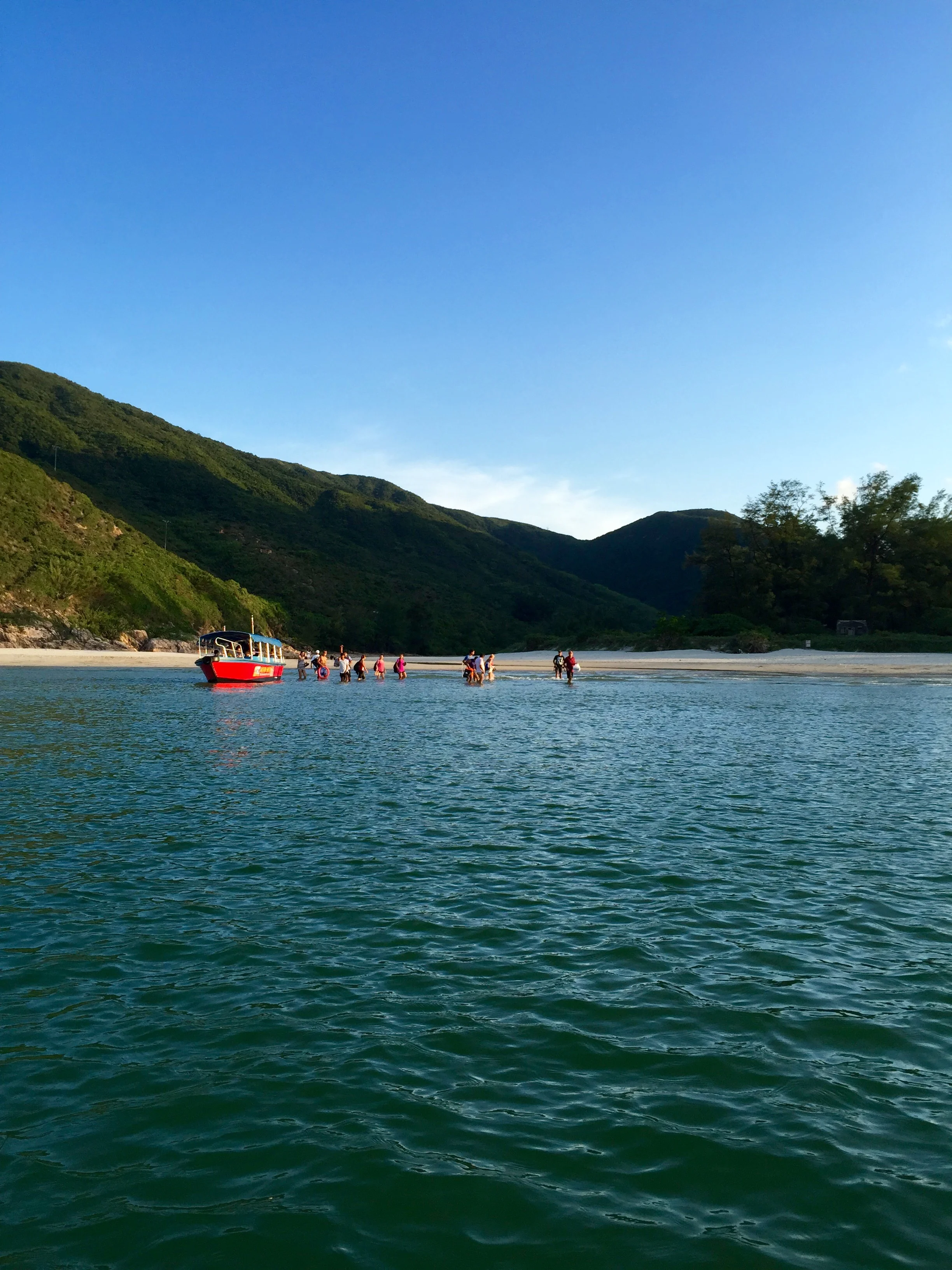 Beachgoers boarding the water taxi.