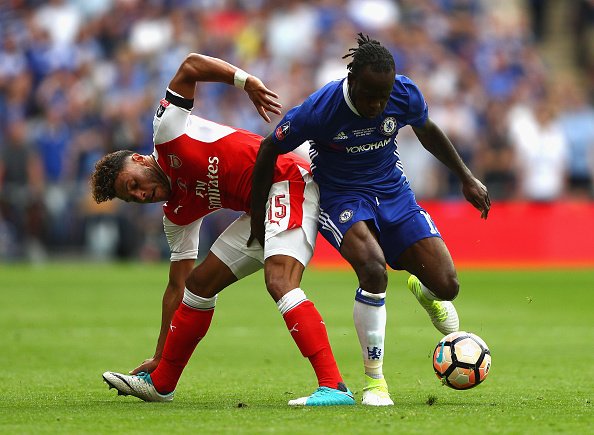 Victor Moses who was dismissed battles with Alex Oxlaide Chamberlain