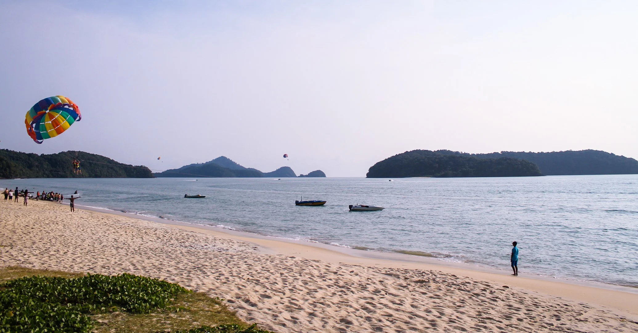 paragliding at cenang beach, langkawi, malaysia.