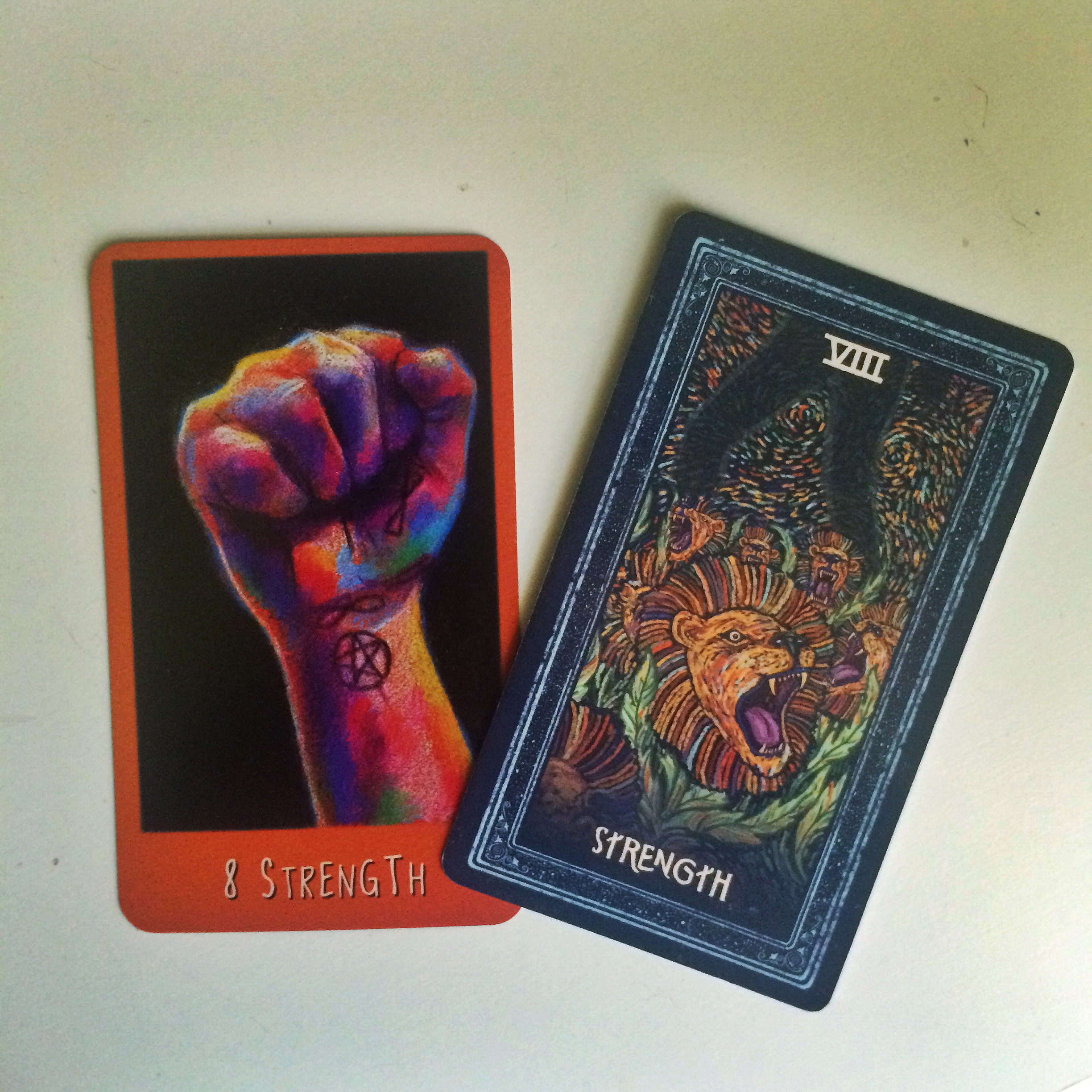 Two of my favorite depictions of the Strength card in my tarot decks... (Left: The Raven's Prophecy Tarot, Right: The Prisma Visions Tarot)