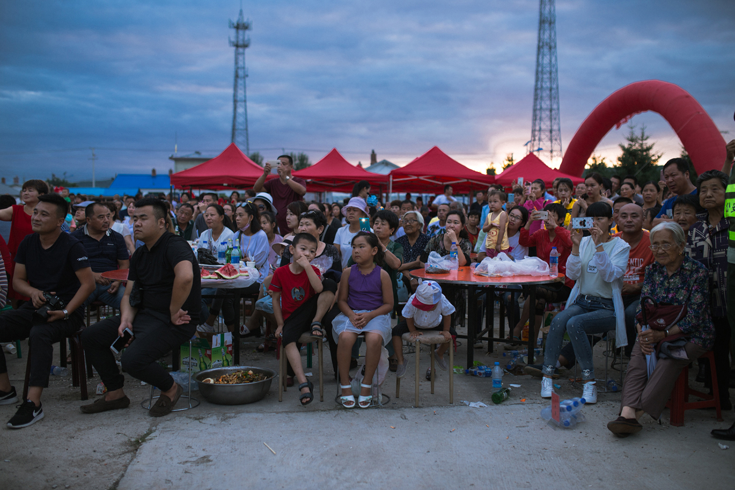 Xin'e Oroqen Settlement, August 2017 A crowd gathers to watch the annual Fire Festival in Xin'e, Heilongjiang Province. 