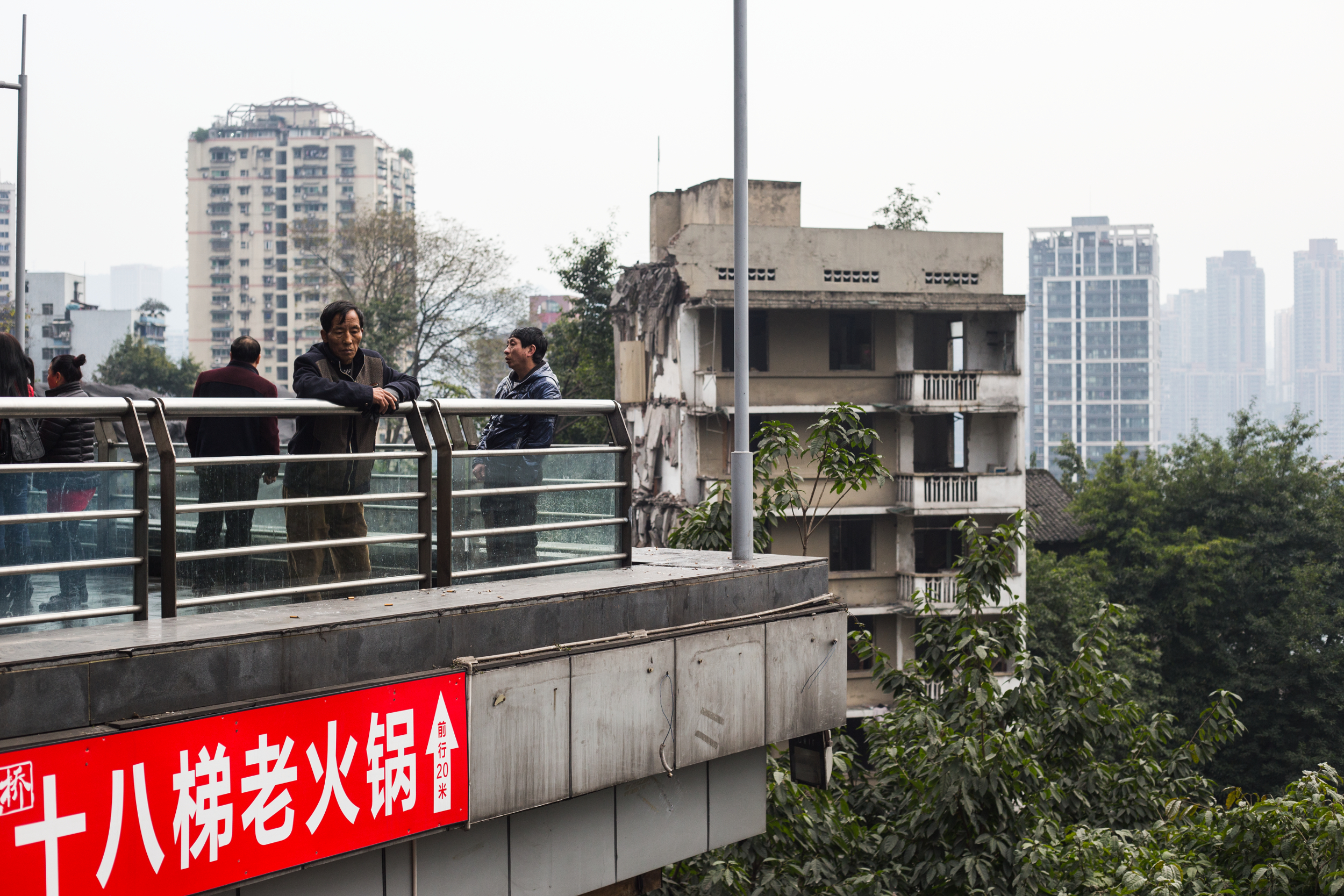 As old buildings are torn down, new ones spring up to replace them. Chongqing, February 2017