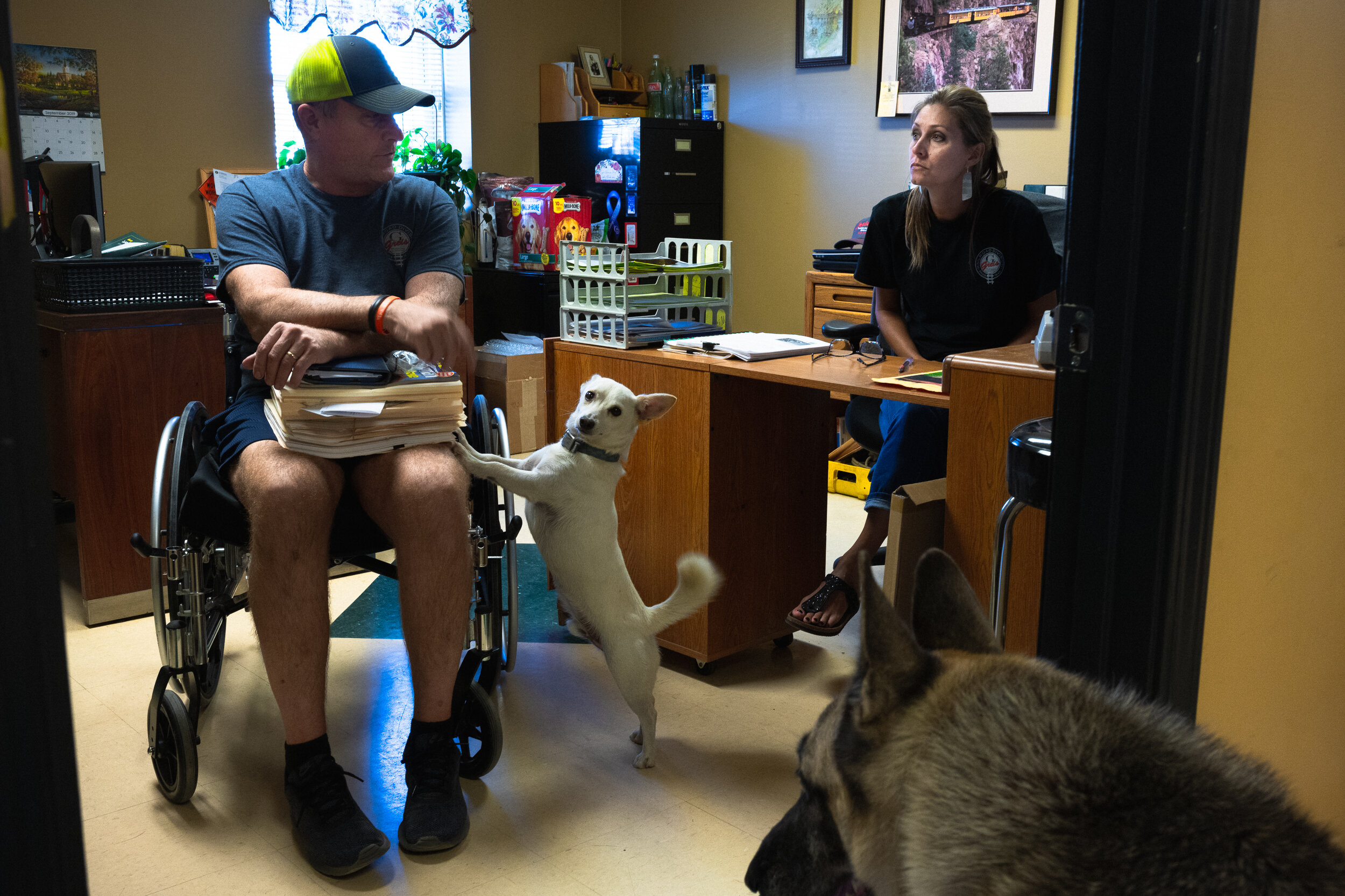 On his first day back at the office after the fire, Clark discusses a project with his younger sister Denise, who has picked up much of the strain since his accident. “I’ve never had a job other than this. I was doing this at eight-years-old,” Clark said.
