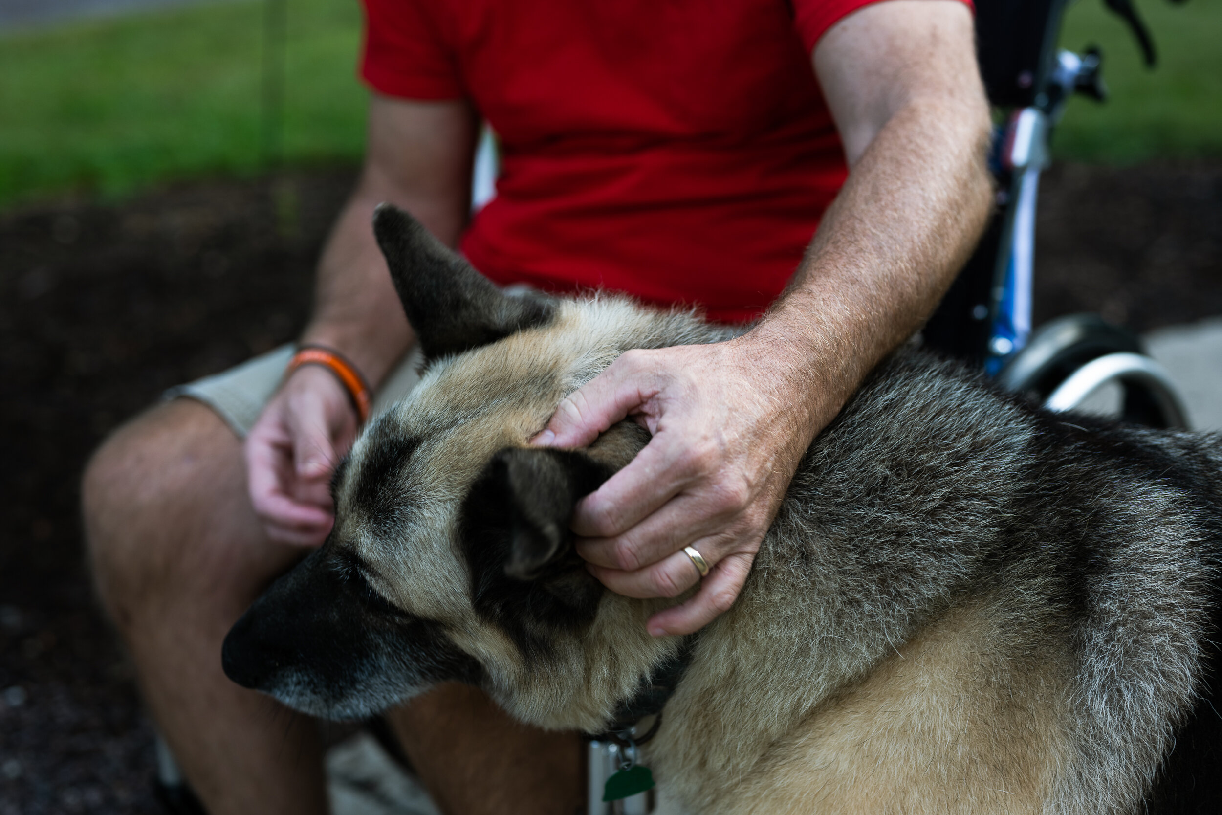 Clark plays with his dog Duke. Joining the the family as a puppy, he has a strong bond with Clark, who talks to him throughout the day. Now eleven-years-old, Duke’s back legs are failing and Clark gives him painkillers wrapped in home-smoked beef jerky.