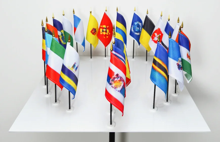 Generative model UN, AI-designed flags, plexiglas, 40 x 23 x 23 in.