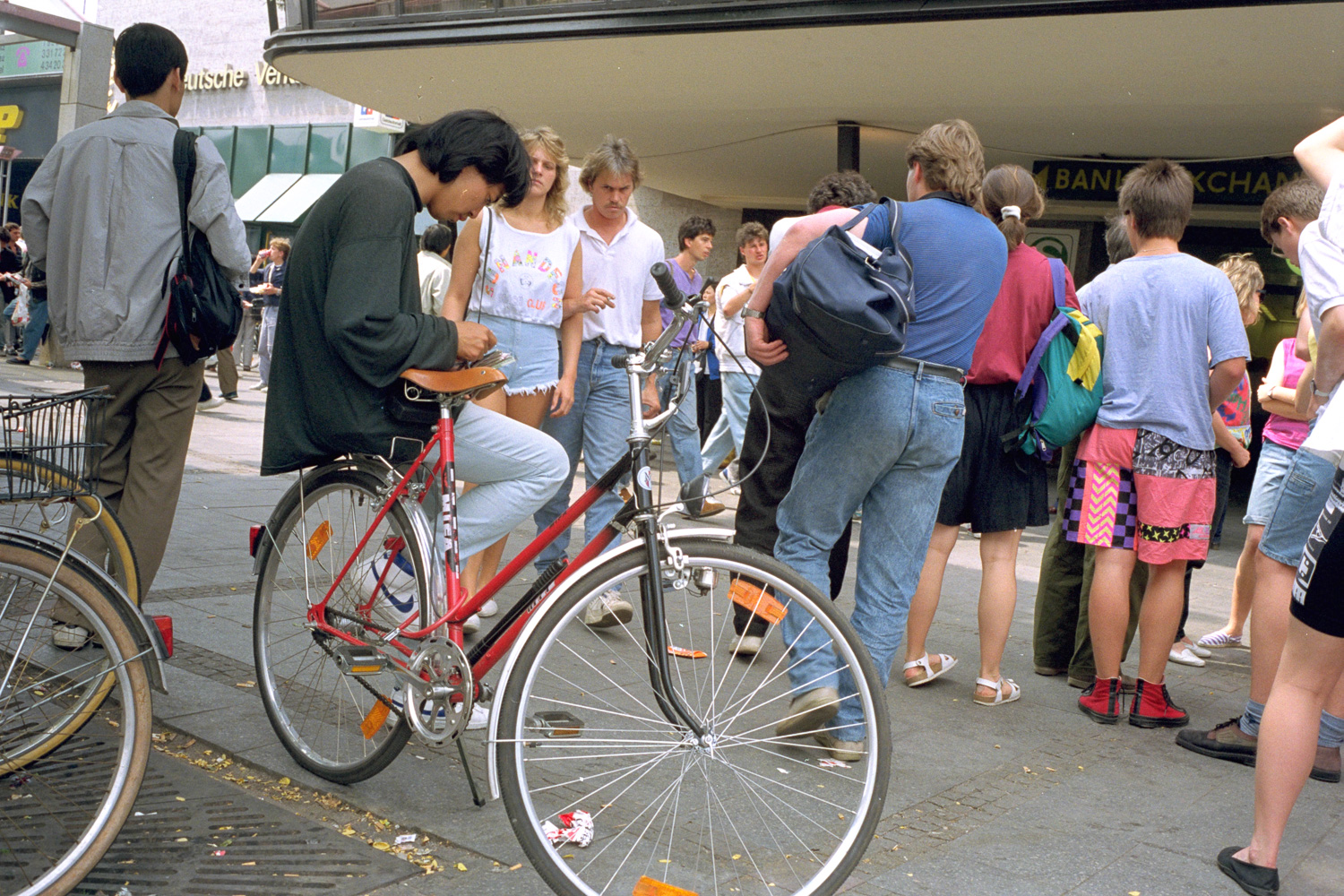  Near the Zoo train station downtown West Berlin.This man is selling cigarrettes and changing money. 