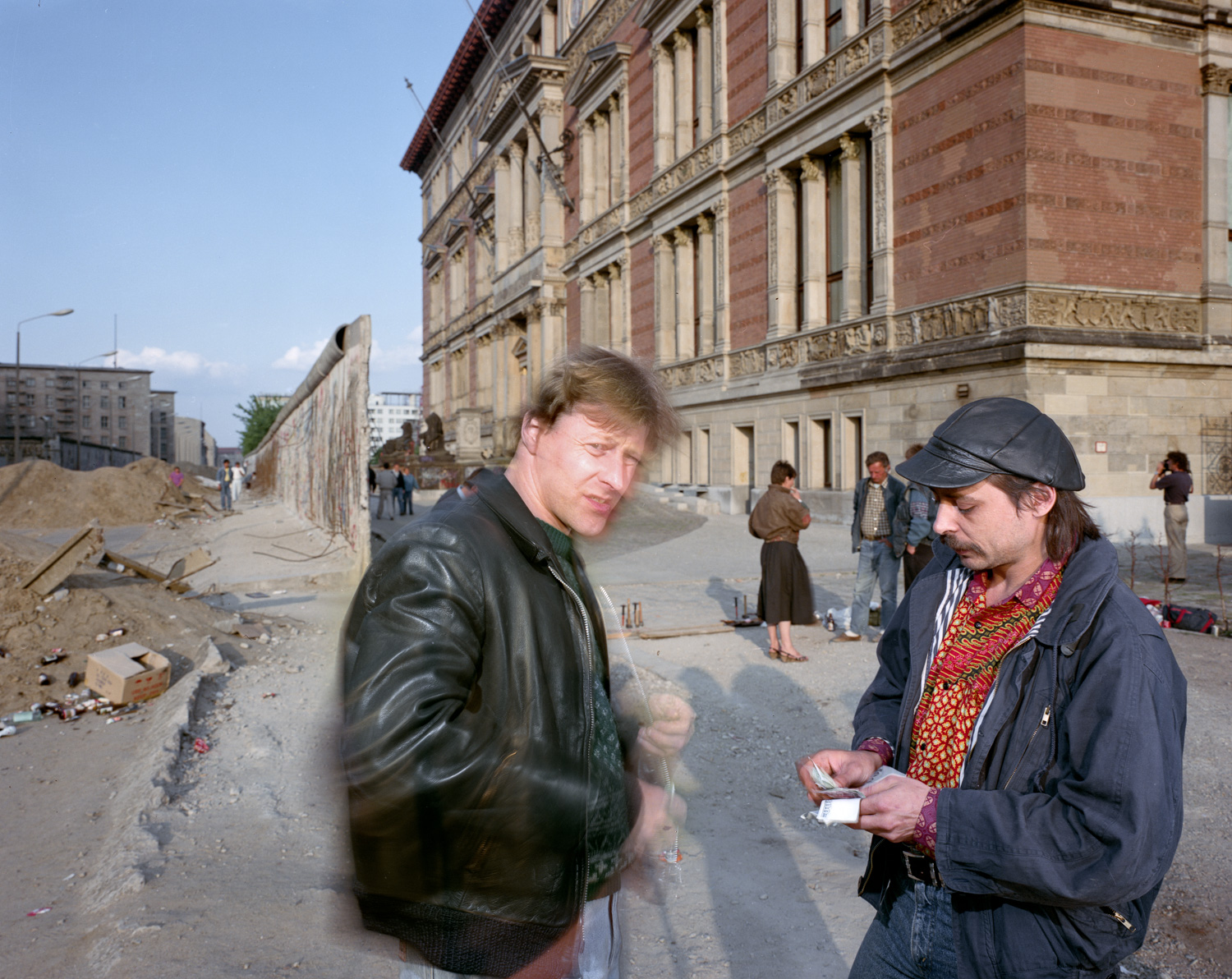 A little docudrama - two men changing money near the wall behind Martin Gropius - Bau. Berlin 1990.
Normal
0
false
false
false
EN-CA
X-NONE
X-NONE
/* Style Definitions */
table.MsoNormalTable
{mso-style-name:"Table Normal";
mso-tstyle-rowband-size:0;
mso-tstyle-colband-size:0;
mso-style-noshow:yes;
mso-style-priority:99;
mso-style-parent:"";
mso-padding-alt:0cm 5.4pt 0cm 5.4pt;
mso-para-margin-top:0cm;
mso-para-margin-right:0cm;
mso-para-margin-bottom:8.0pt;
mso-para-margin-left:0cm;
line-height:107%;
mso-pagination:widow-orphan;
font-size:11.0pt;
font-family:"Calibri",sans-serif;
mso-ascii-font-family:Calibri;
mso-ascii-theme-font:minor-latin;
mso-hansi-font-family:Calibri;
mso-hansi-theme-font:minor-latin;
mso-fareast-language:EN-US;}