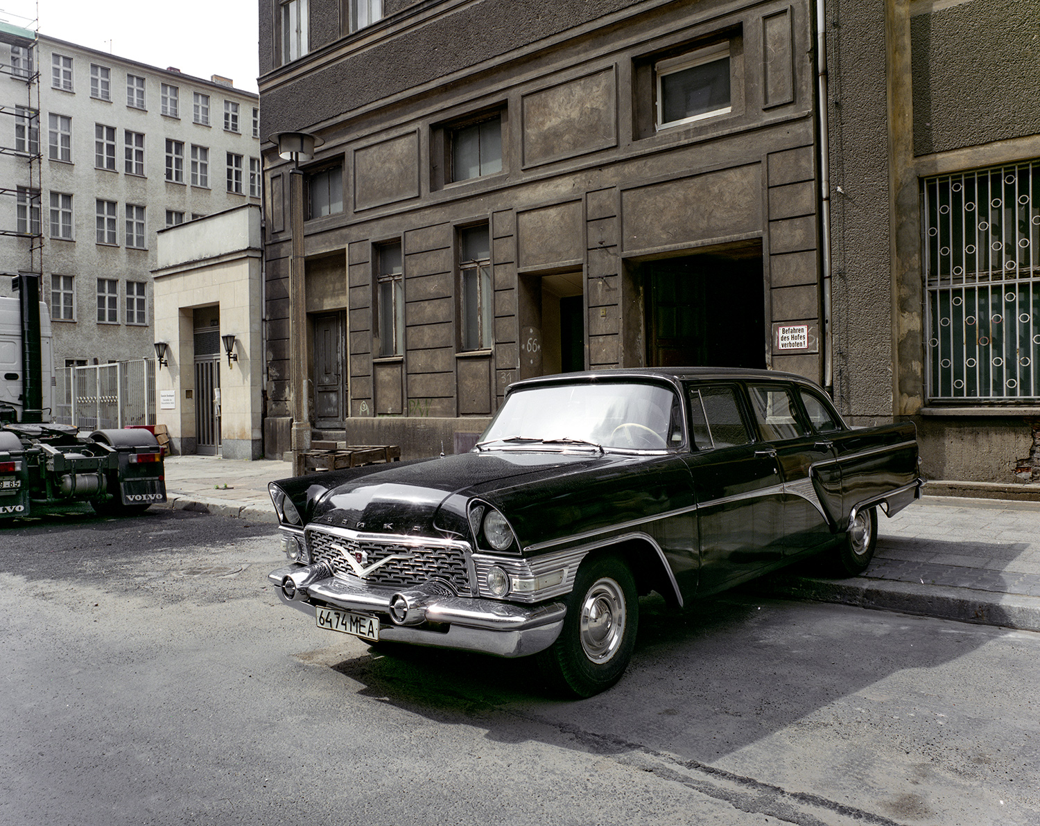     
 
      This car is a Chaika a Soviet product . According to Wikipedia it is a "a second tier limousine" of the sort reserved for official use and not for purchase by the general public. Looks suspiciously similar to a 57 Chevrolet.     
 Normal