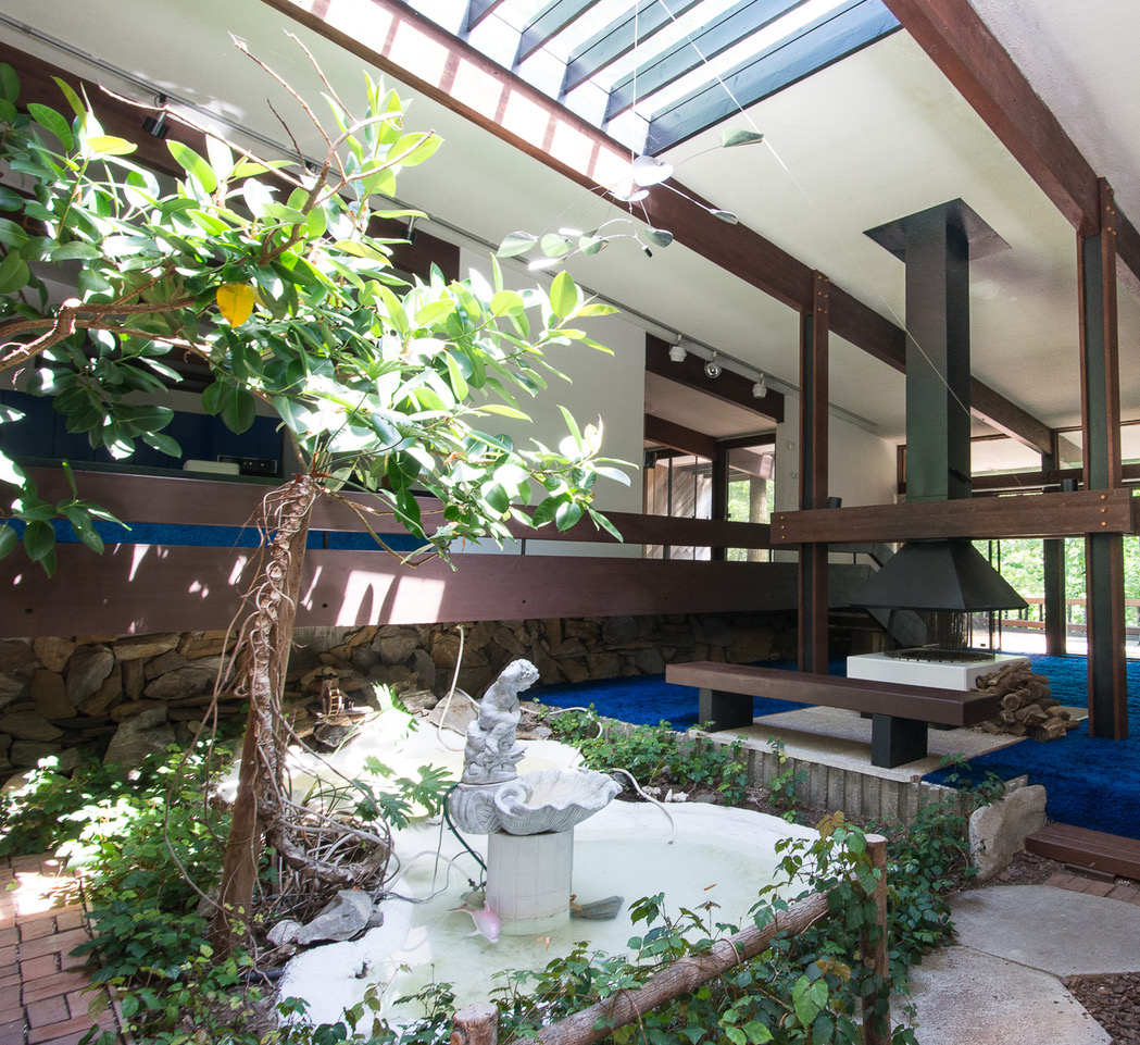 The living room once featured a custom koi pond!