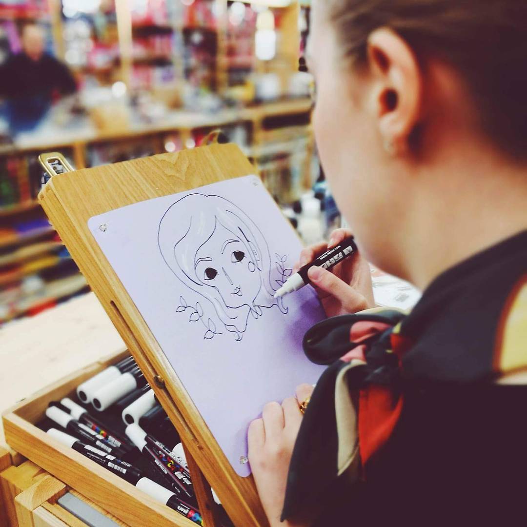 Chloe drawing a super cute portrait