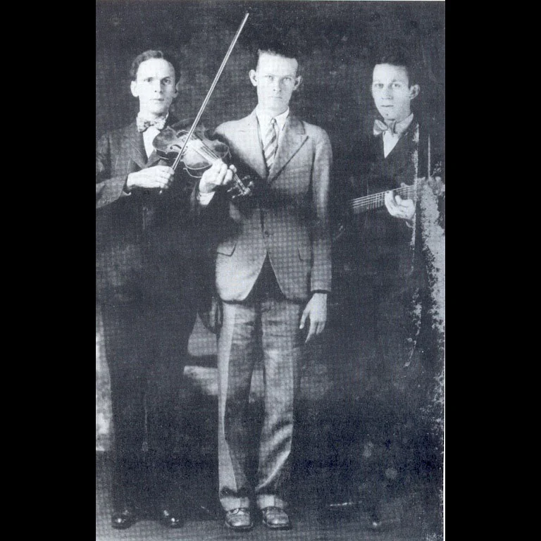 Dance caller, Ernest Legg (center) with the Kessinger Brothers (Charleston, WV, 1928)