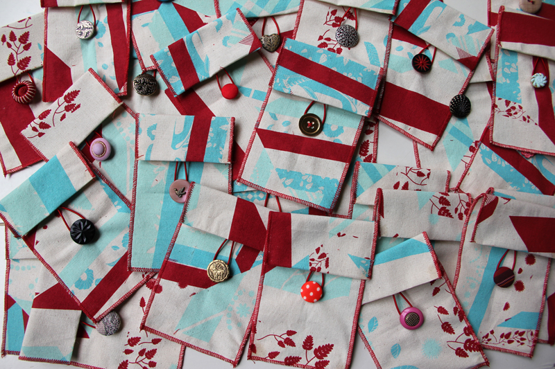 Custom playing card pouches with assorted buttons