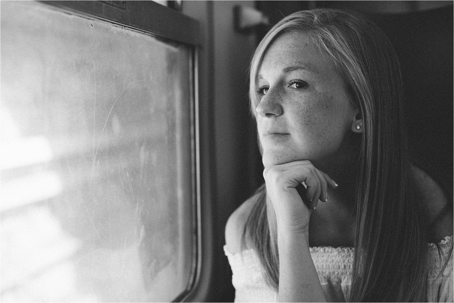 Kirsten contemplating her life as babies scream on the train. 