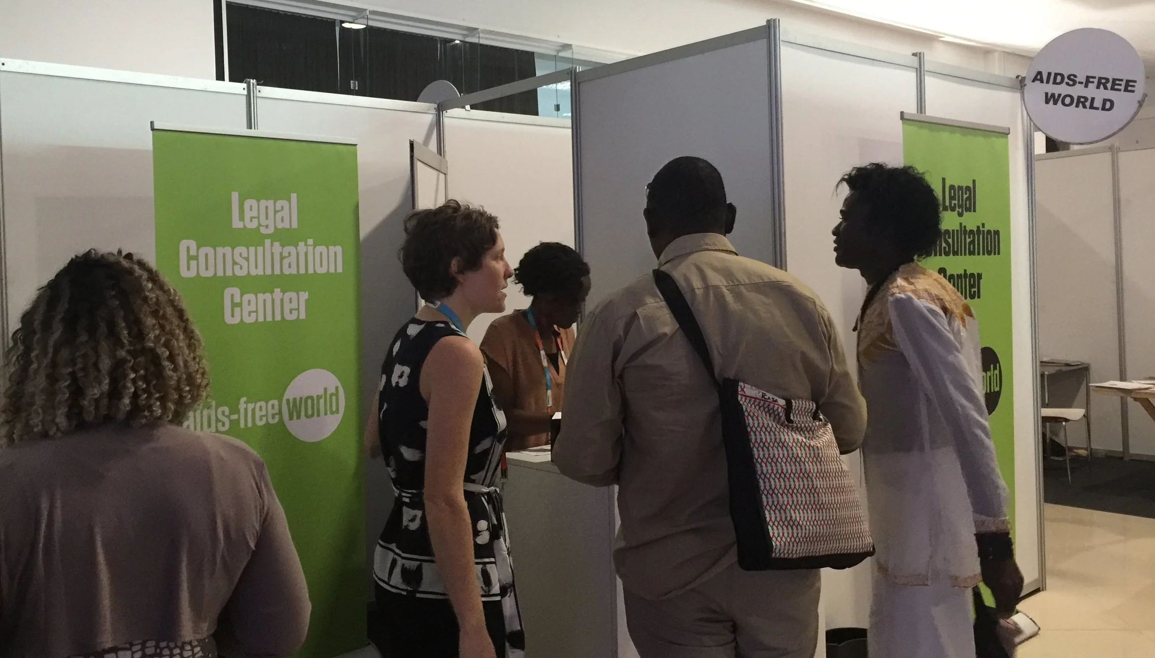 Volunteer lawyers speak with delegates at the International Conference on AIDS and STIs in Africa (ICASA) in Abidjan, Côte d'Ivoire. (Photo: ©AIDS-Free World)