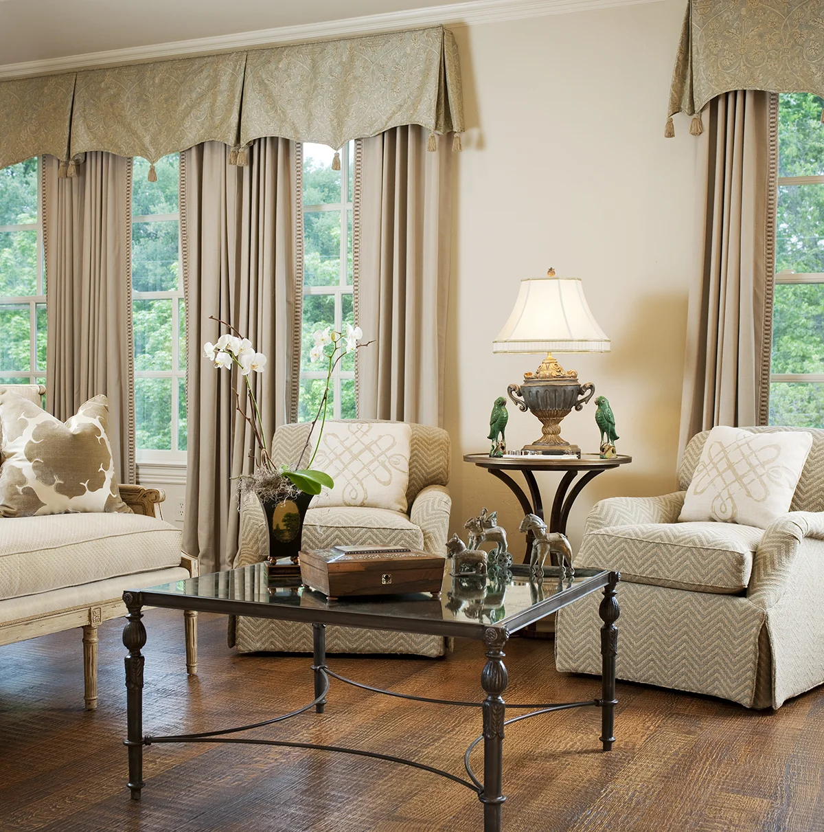 We incorporated antiques into this University Park bedroom while also using simple drapes, clean lines, and neutral tone-on-tone colors. The result is a room both classical and refreshingly modern.