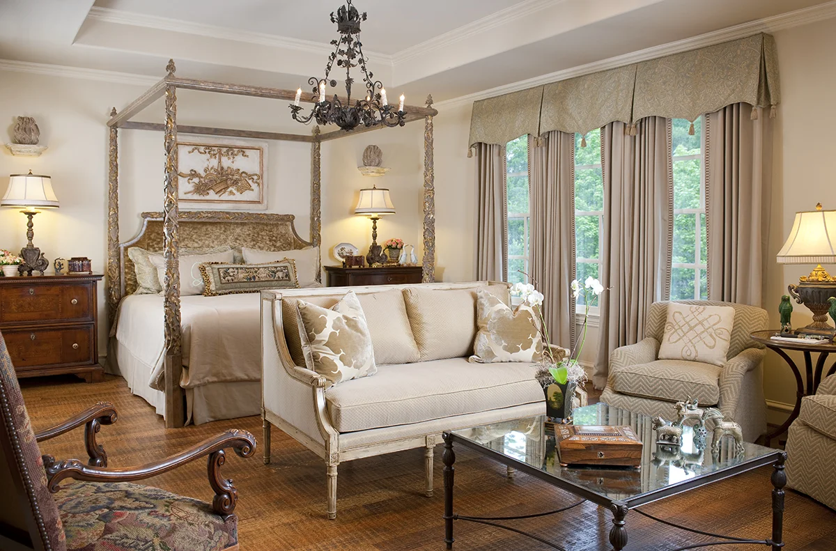 This master bedroom has a very harmonious color scheme, but on closer inspection, there is a good deal of contrast introduced in the different wood finishes and colors.
