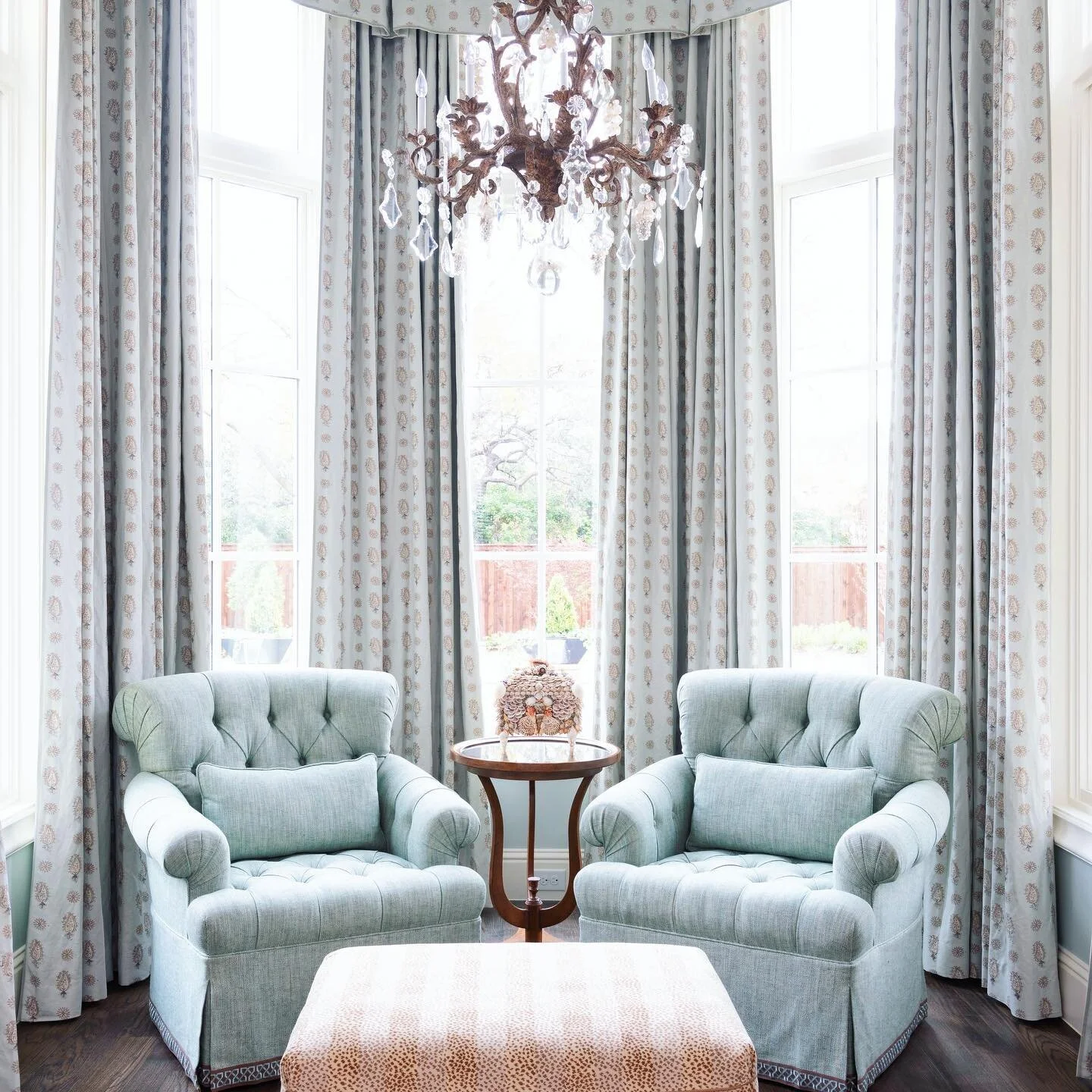 Our clients have loved this sitting area in their master bedroom - a bright and peaceful corner perfect for reading with a cup of tea. (Chairs and ottoman by @ebanista with @clarencehousetextiles, shell box from @curreyco)