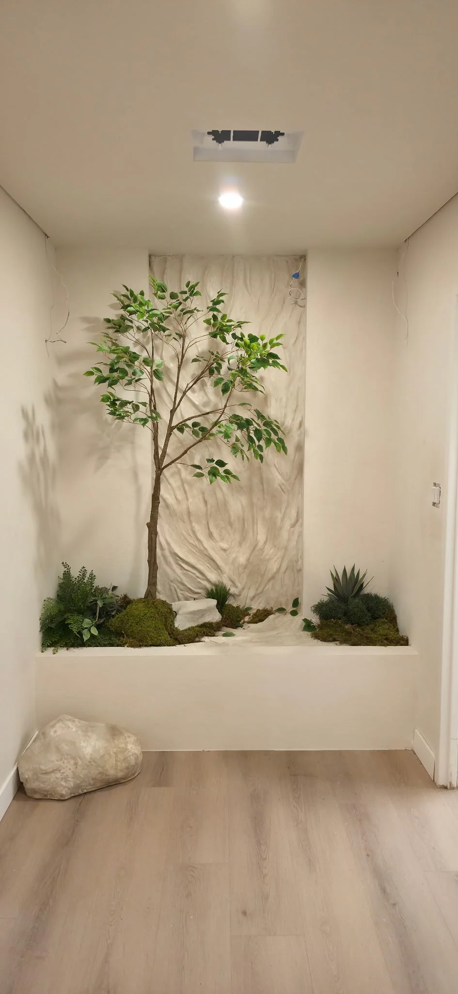  Water texture sculptural plaster wall including faux stones 