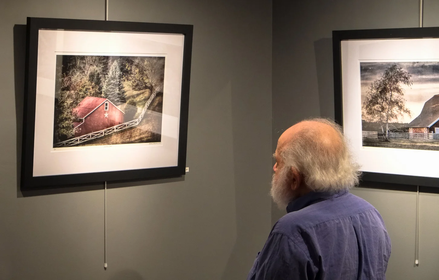 Michael Edelson admiring works.jpg