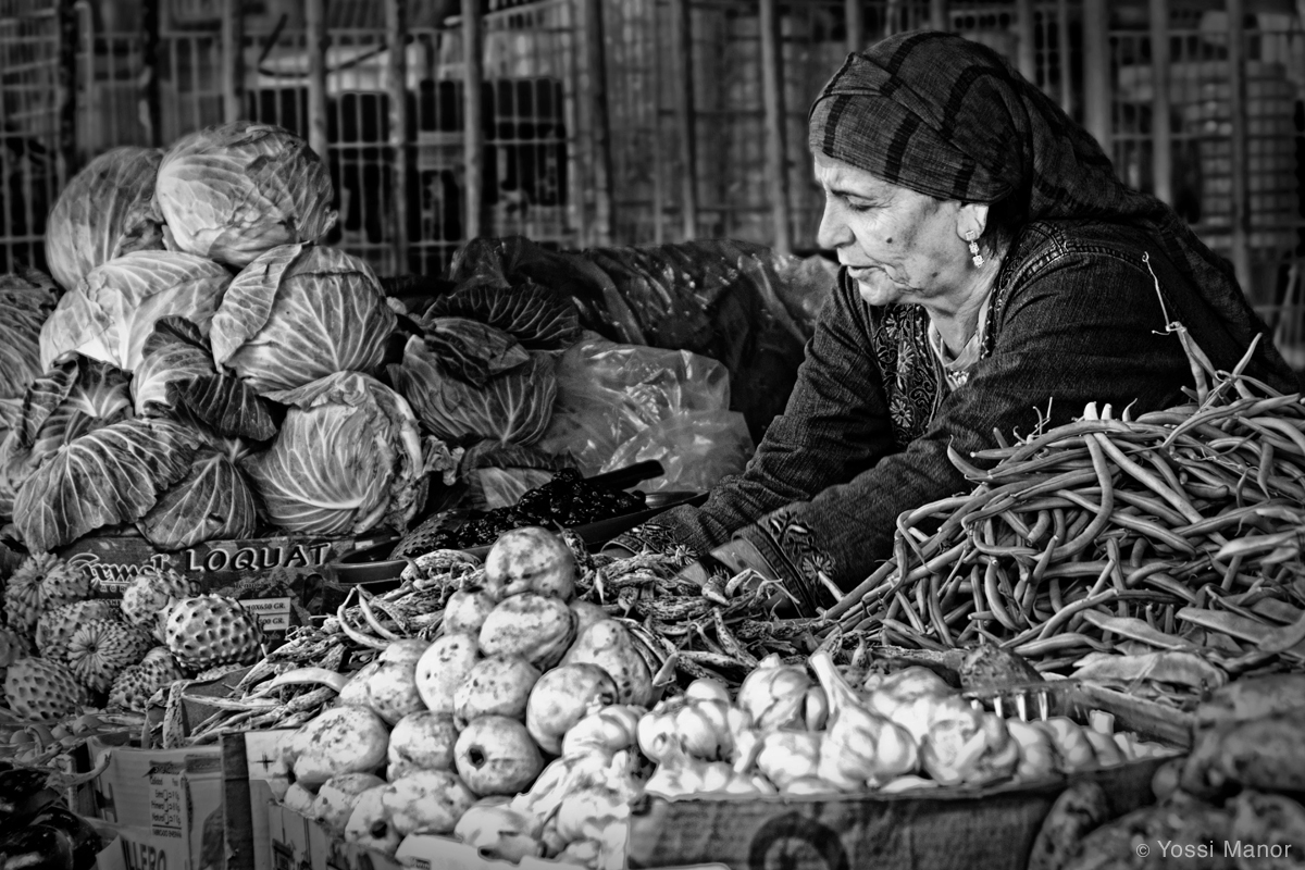 Vendor at the Market by Yossi Manor