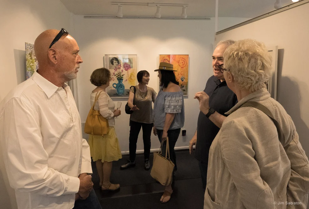 Artist, Steven Schreiber with guests. In background, artist, Katherine Liepe-Levinson with guests, Suzette Reiss and director East End Arts, Diane Burke.