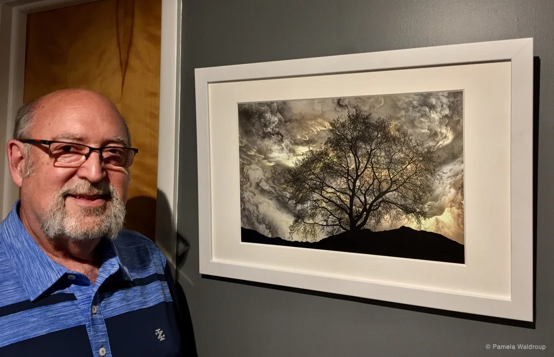 Artist, Mac Titmus with his work, “To Dream a New Dream”.