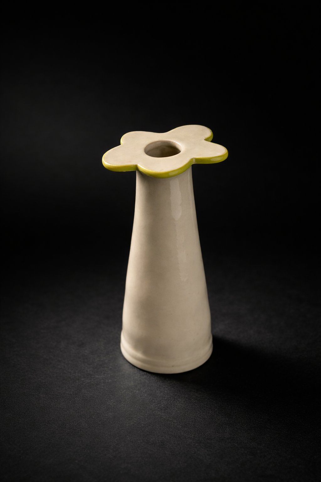 Elegant ceramic vase with flower top.png