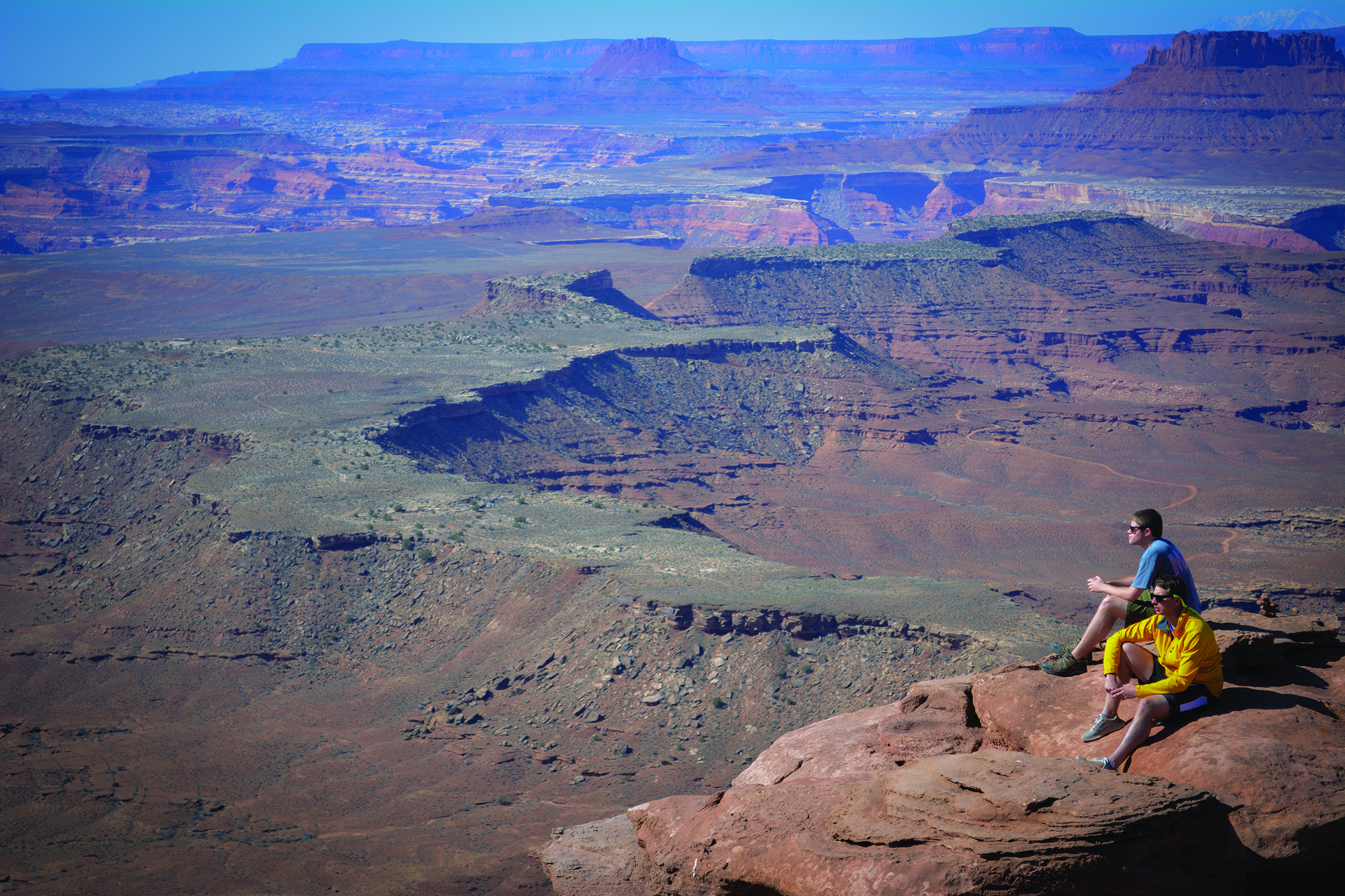   Hikers overlook Canyonlands National Park from Murphy Point at Island In The Sky.&nbsp;Photo Neill Pieper  