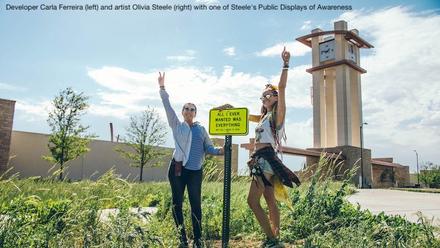 Developer Carla Ferreira (left) and Artist Olivia Steele (Right) with one of Steele's Public Displays of Awareness.jpg