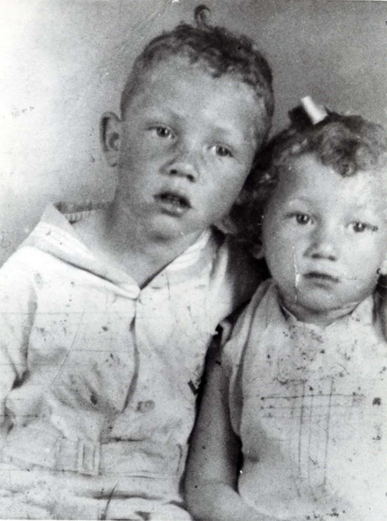 Benny and sister Val, c. 1934
0
Normal
0
false
false
false
EN-US
X-NONE
X-NONE
/* Style Definitions */
table.MsoNormalTable
{mso-style-name:"Table Normal";
mso-tstyle-rowband-size:0;
mso-tstyle-colband-size:0;
mso-style-noshow:yes;
mso-style-priority:99;
mso-style-parent:"";
mso-padding-alt:0in 5.4pt 0in 5.4pt;
mso-para-margin:0in;
mso-para-margin-bottom:.0001pt;
mso-pagination:widow-orphan;
font-size:10.0pt;
font-family:"Times New Roman";}
96
Normal
0
false
false
false
EN-US
X-NONE
X-NONE
/* Style Definitions */
table.MsoNormalTable
{mso-style-name:"Table Normal";
mso-tstyle-rowband-size:0;
mso-tstyle-colband-size:0;
mso-style-noshow:yes;
mso-style-priority:99;
mso-style-parent:"";
mso-padding-alt:0in 5.4pt 0in 5.4pt;
mso-para-margin:0in;
mso-para-margin-bottom:.0001pt;
mso-pagination:widow-orphan;
font-size:12.0pt;
font-family:Calibri;
mso-ascii-font-family:Calibri;
mso-ascii-theme-font:minor-latin;
mso-hansi-font-family:Calibri;
mso-hansi-theme-font:minor-latin;}
1930-1943 Benny Andrews is born on November 13, 1930, in Plainview, Georgia, a farming community three miles from Madison, to George and Viola Andrews. He is one of ten children. George is a sharecropper and self-taught artist. Andrews begins working in the fields as a young child. He also attends Plainview Elementary School, a one-and-a-half room log cabin built by Plainview's African American community. 
