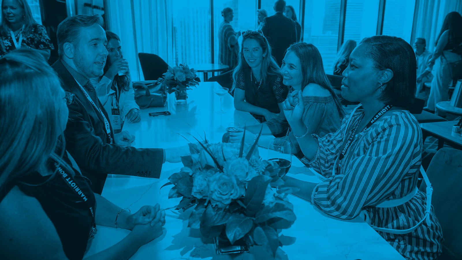 James Alan performs close up magic for a group at a corporate conference at the Sheraton Centre Hotel