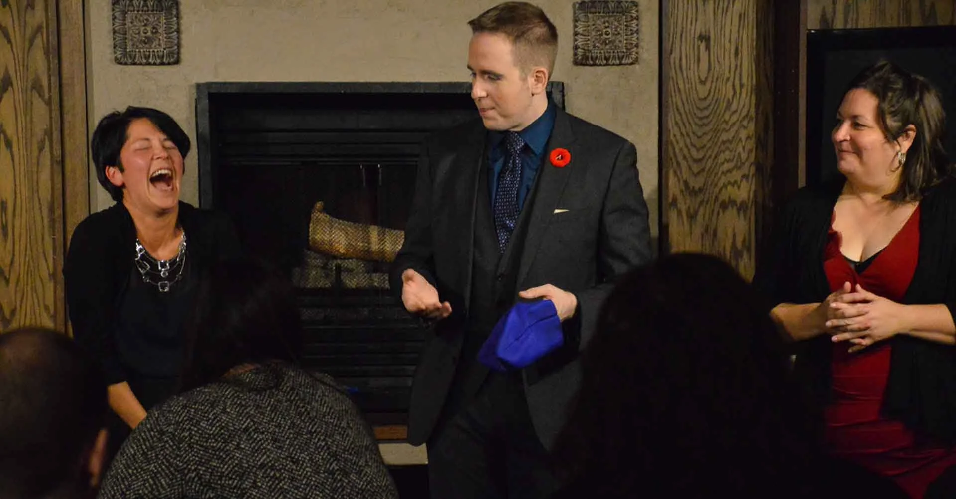 James Alan with two laughing audience members in Magic and Martini in Oakville