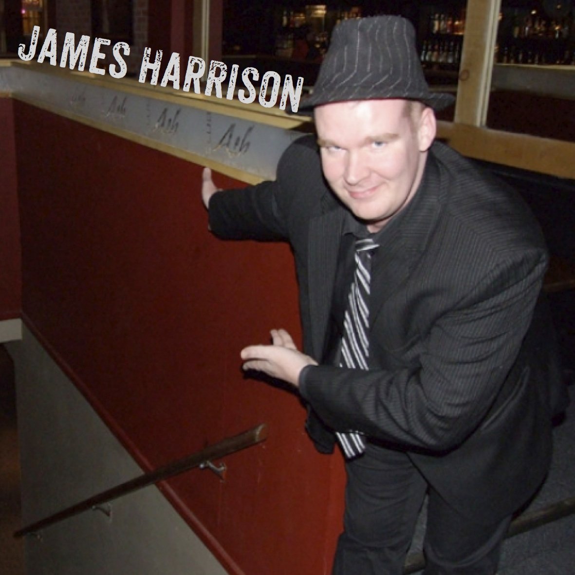 James Harrison Headshot at the top of the stairs inviting you to go first