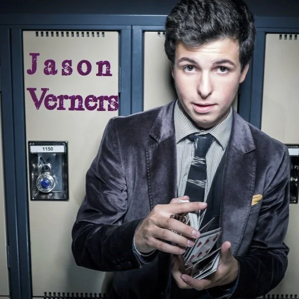 Jason Verners promotional image handling cards in front of school lockers