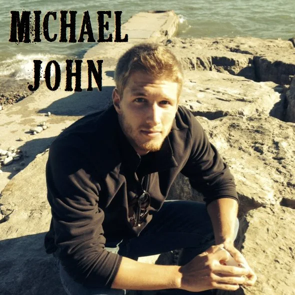 Michael John Headshot On a Mountaintop