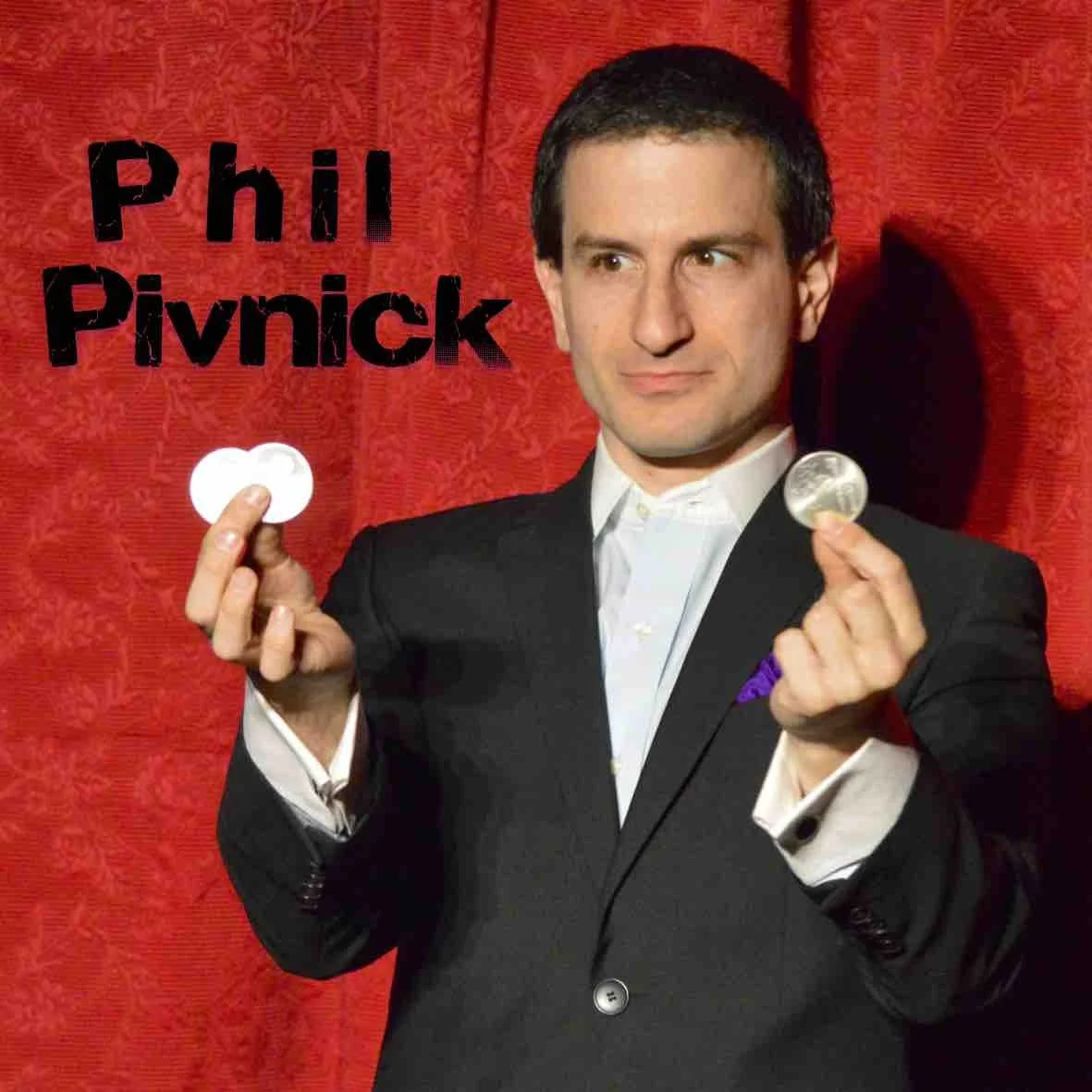 Phil Pivnick does a coin trick on stage at the Crimson Lounge