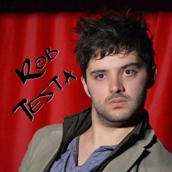 Rob Testa looking confused on stage at the Crimson Lounge